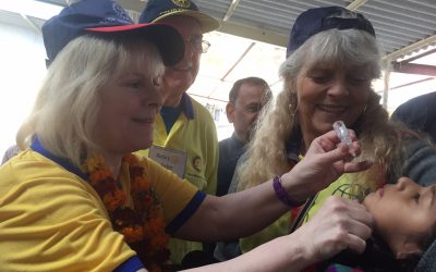 eve conway and rotary members vaccinating children against polio