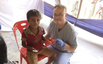 medical camp set up for the refugees who have fled to bangladesh. boy and doctor