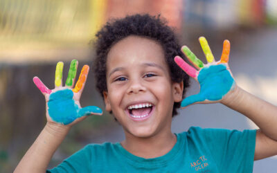 happy boy with painted hands, artistic